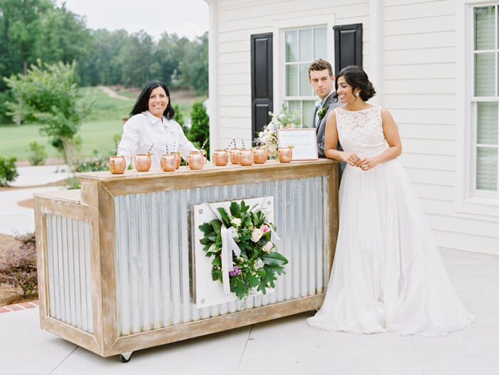 Cocktail Hour with Copper Moscow Mule Mugs and Metal Bar Outdoor NC wedding Casey Rose Photography The benefits of a small wedding