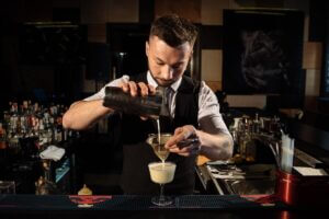 bartender pouring custom drink
