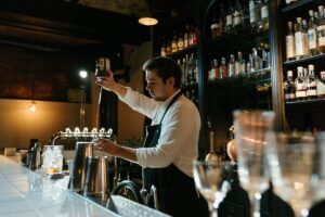 wedding bartender pouring drink