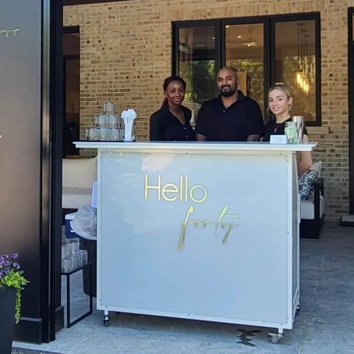 Full Circle mobile bartending team serving guests at an event